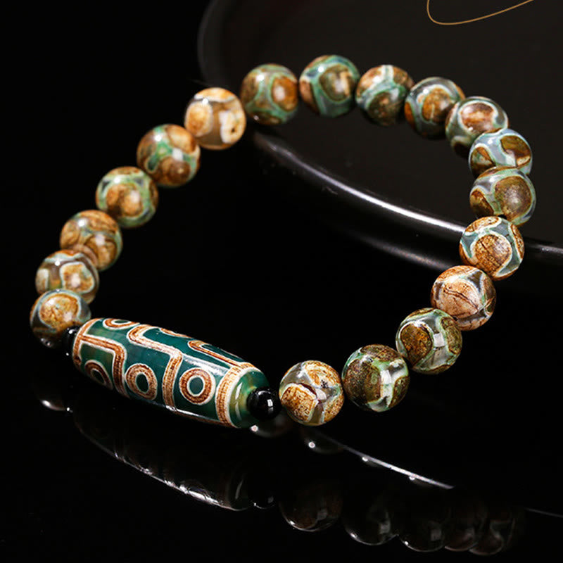 Buddha Stones Tibetische Neun-Augen-Dzi-Perle Natürliches Sandelholz Weißes Katzenauge Achat Kraftschutzarmband