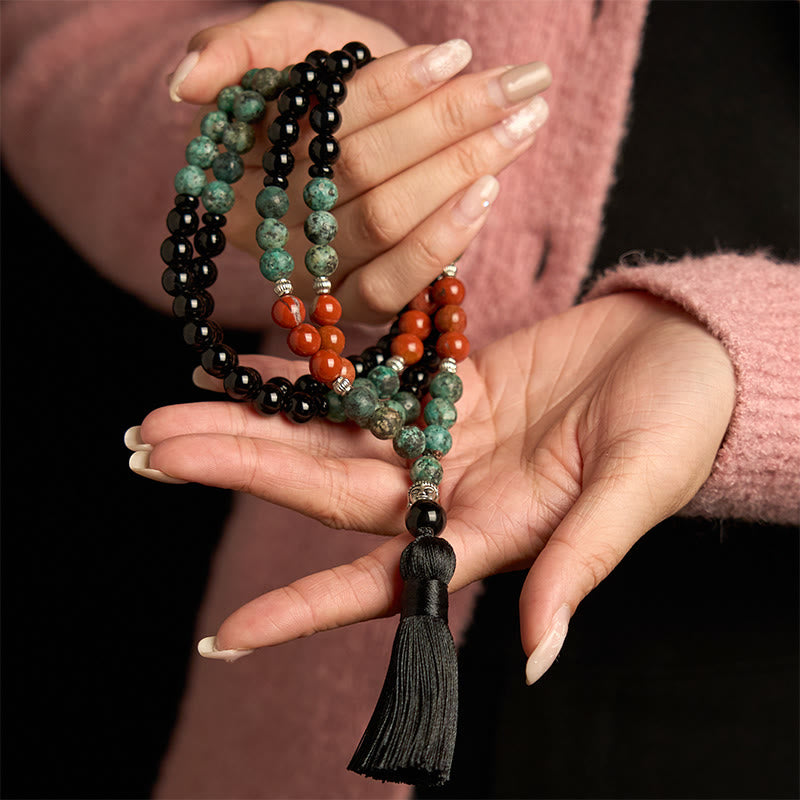 Buddha Stones 108 Mala, natürlicher schwarzer Onyx, roter Jaspis, Türkisperlen, Buddhakopf, Quaste, Schutzarmband