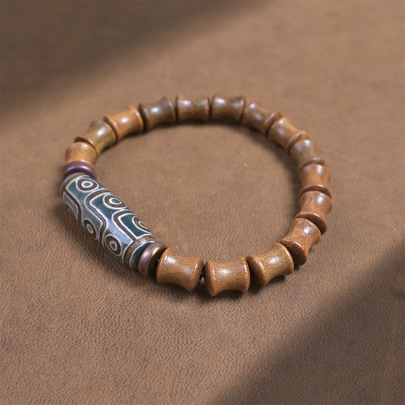 Buddha Stones Tibetisches Neun-Augen-Dzi-Perlen-Friedensarmband aus grünem Sandelholz