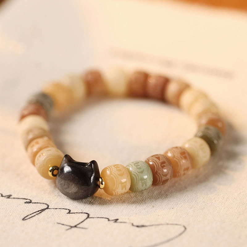 Buddha Stones, Bodhi-Samen, Om Mani Padme Hum, geschnitztes Silber, Glanz, Obsidian, Katzenkopf, Weisheitsarmband - 8 x 10 mm gelber Bodhi-Samen (Handgelenkumfang 14–16 cm) - image 1