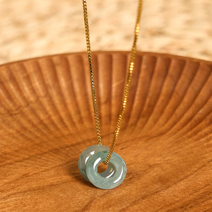 Halskette mit Anhänger aus Jade mit doppelter Friedensschnalle und Wohlstandssymbol von Buddha Stones