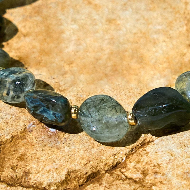 Buddha Stones Schutzarmband aus geflochtenem grünem Rutilquarz