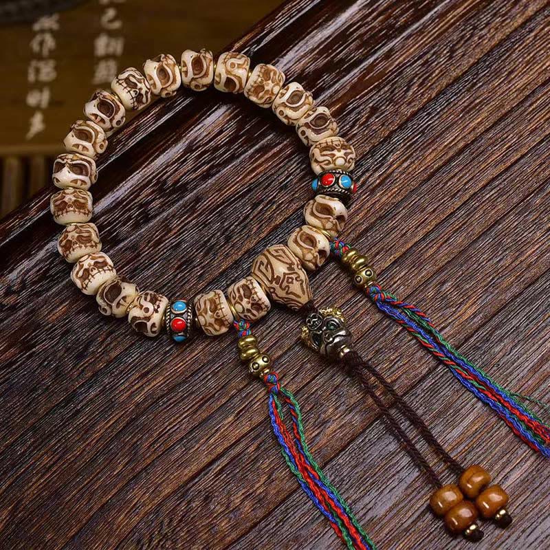 Armband mit Quaste aus tibetischem Kamelknochen und geschnitztem Garuda-Schutz aus Buddha Stones