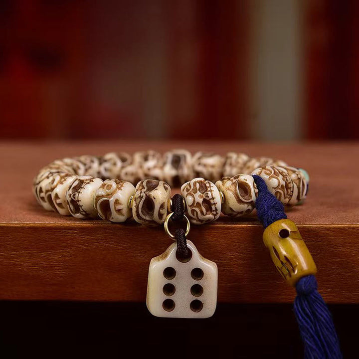 Armband mit Quaste aus tibetischem Kamelknochen und geschnitztem Garuda-Schutz aus Buddha Stones