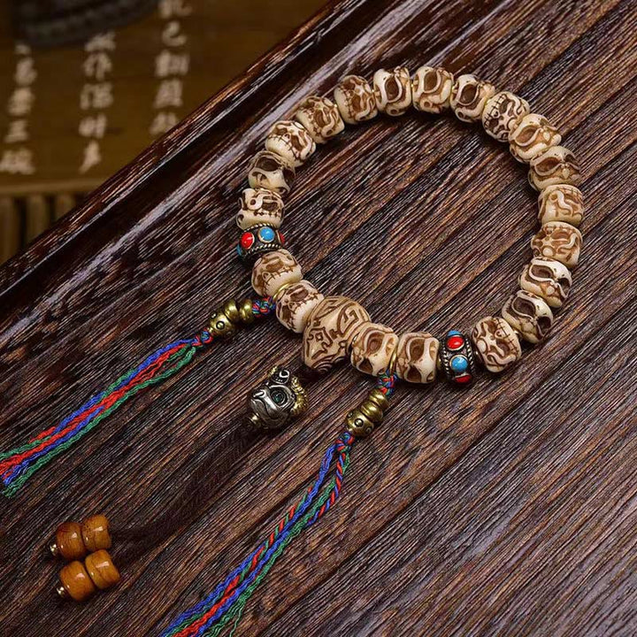 Armband mit Quaste aus tibetischem Kamelknochen und geschnitztem Garuda-Schutz aus Buddha Stones