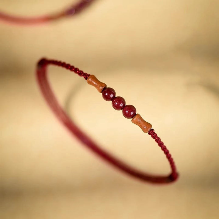 Buddha Stones Zinnoberperlen Pfirsichholz Segensschnur Armband