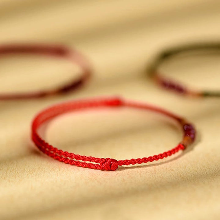 Buddha Stones Zinnoberperlen Pfirsichholz Segensschnur Armband