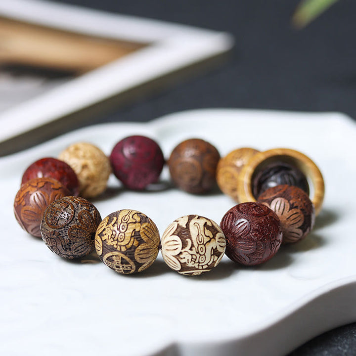 Buddha Stones, die Sandelholz schnitzen, chinesisches Sternzeichen, glückverheißender Drache, Phönix, Fu-Charakter, Heilungsarmband