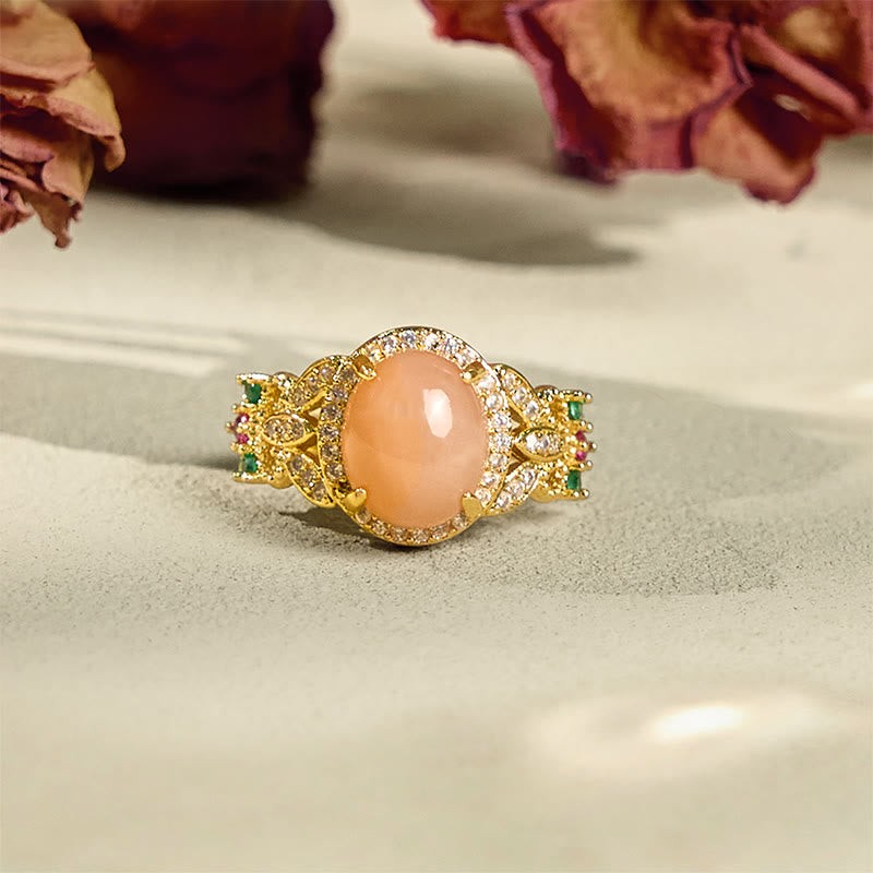 Buddha Stones Vintage-Ring mit Krappenfassung, vierblättriges Blumendesign, Pfirsichmondstein, verstellbar, beruhigend