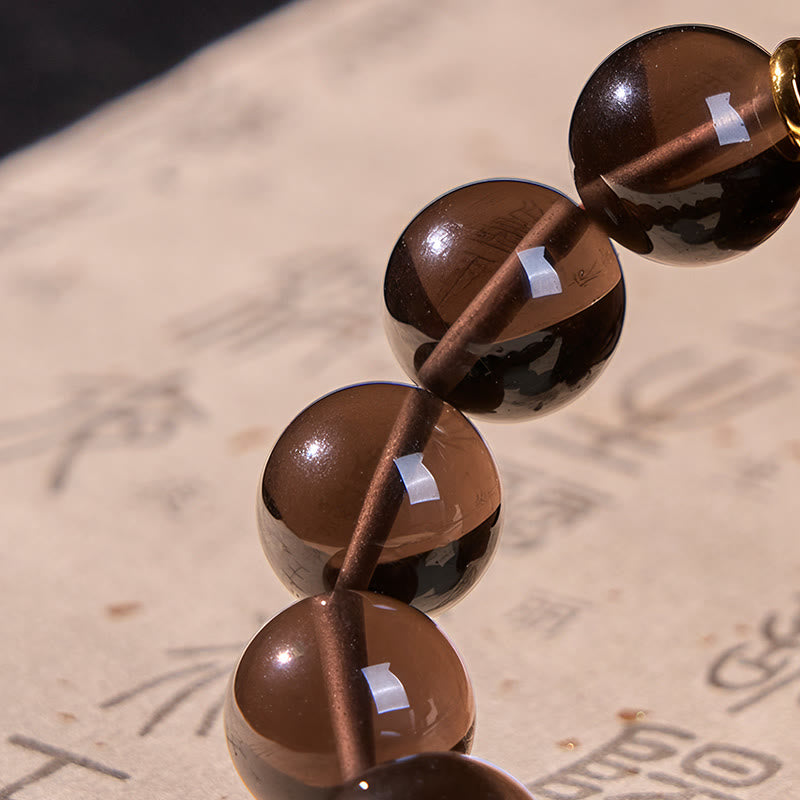 Buddha Stones Eisobsidian Sanskrit-Mutarmband mit Goldprägung