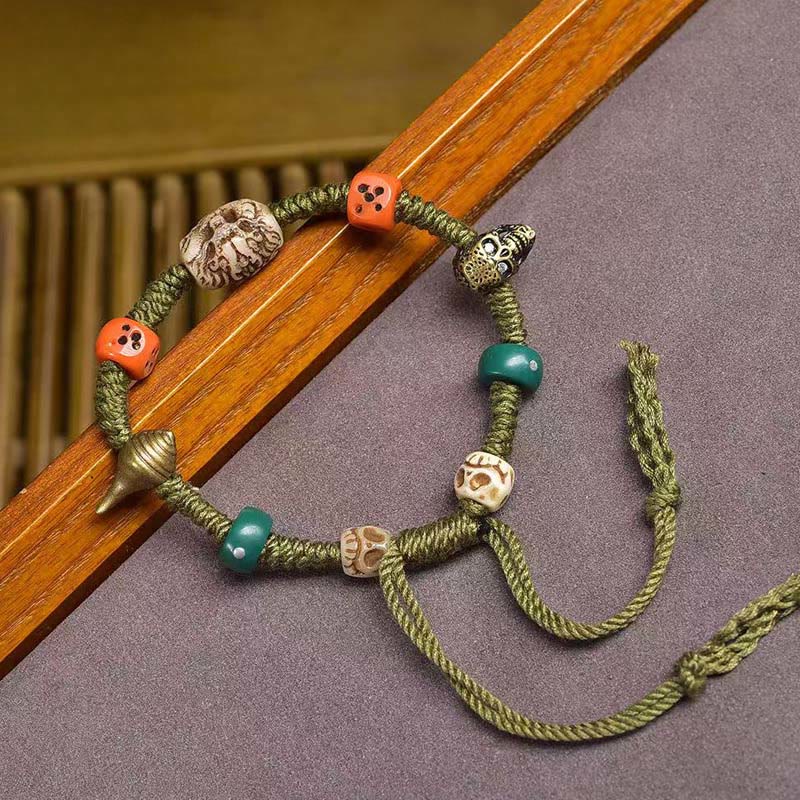 Buddha Stones Tibetisches Drachenmuster Würfel Handgemachtes Seilarmband - image 1