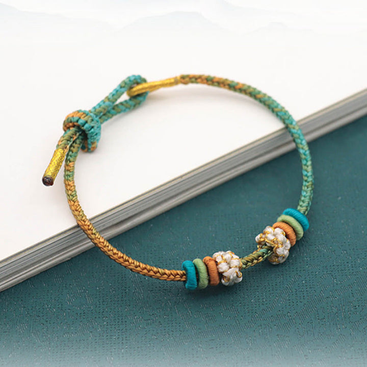 Buddha Stones Handgefertigtes achtfädiges Friedensknoten-Pfirsichblütenknoten-Glücksseil-geflochtenes Armband - image 2