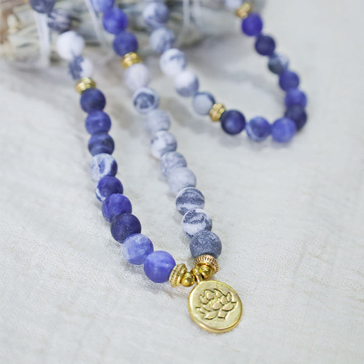 Buddha Stones 108 natürliches Picasso-Jaspis- und Blaustein-Mala-Perlen-Lotus-Anhänger-Armband