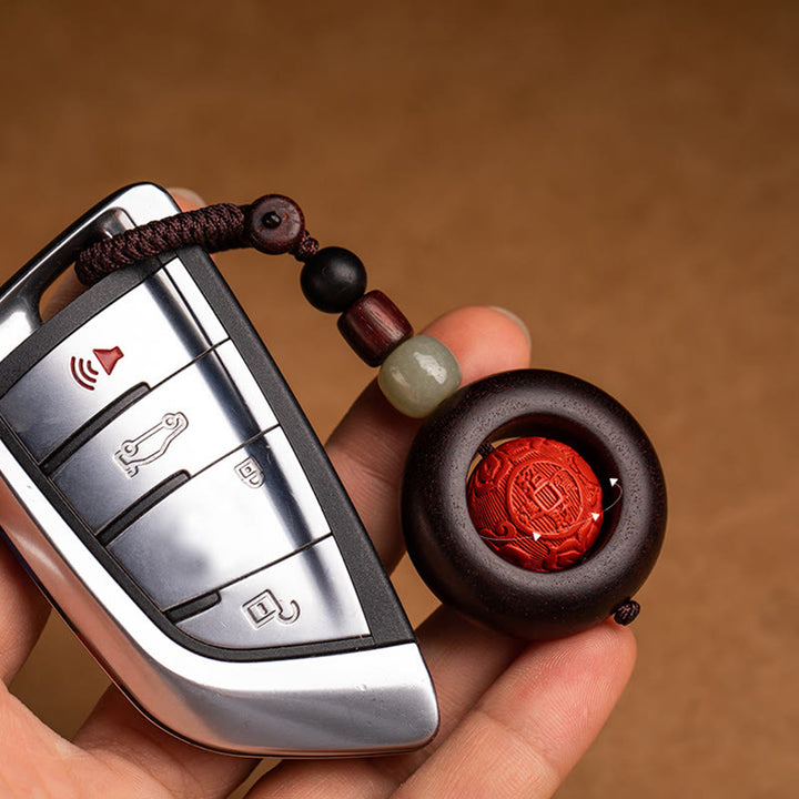 Buddha Stones, Tibet, Om Mani Padme Hum, PiXiu, Kupfermünze, kleines Blatt, rotes Sandelholz, Zinnober, Schutz-Schlüsselanhänger