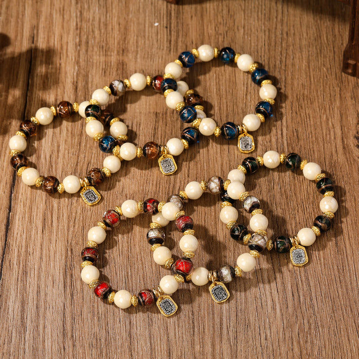 Buddha Stones, tibetische Zakiram-Göttin des Reichtums, Charm-Charm, Liuli, Glas, Weihrauch, Asche, Porzellanperlen, Schutzarmband