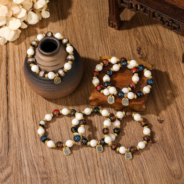 Buddha Stones, tibetische Zakiram-Göttin des Reichtums, Charm-Charm, Liuli, Glas, Weihrauch, Asche, Porzellanperlen, Schutzarmband