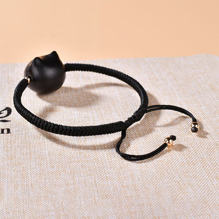 Buddha Stones Ebenholz-Katzenkopf-Muster, geflochtenes Armband mit Friedens-King-Kong-Knoten - image 17