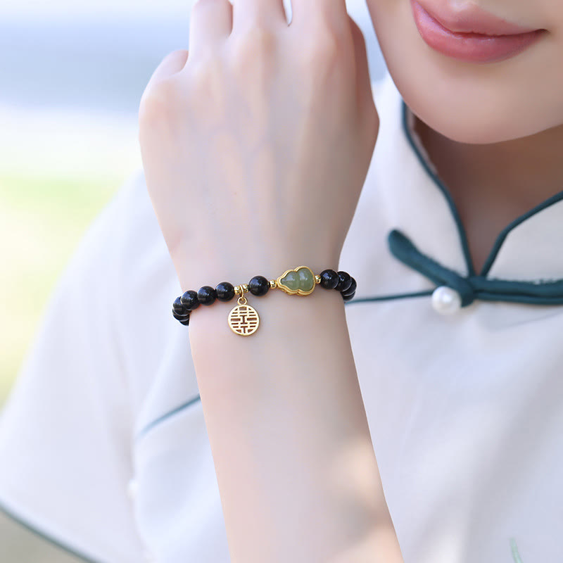 Natürliches schwarzes Obsidian-Hetian-Jade-Kürbis-Armband mit doppelter Glückskraft