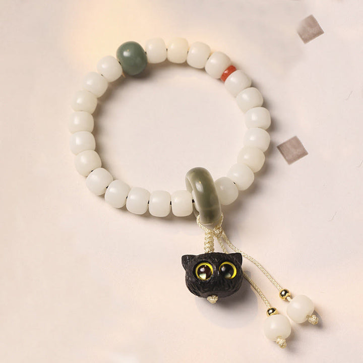 Armband mit Buddha Stonesn, natürlichem Bodhi-Samen, afrikanischem Schwarzholz, hübscher Katzenanhänger, Friedensharmonie - Bodhi-Samen der gelbäugigen Katze - image 1