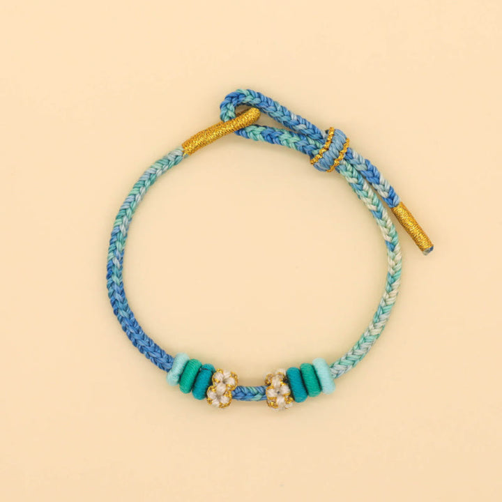 Buddha Stones Handgefertigtes achtfädiges Friedensknoten-Pfirsichblütenknoten-Glücksseil-geflochtenes Armband - image 11