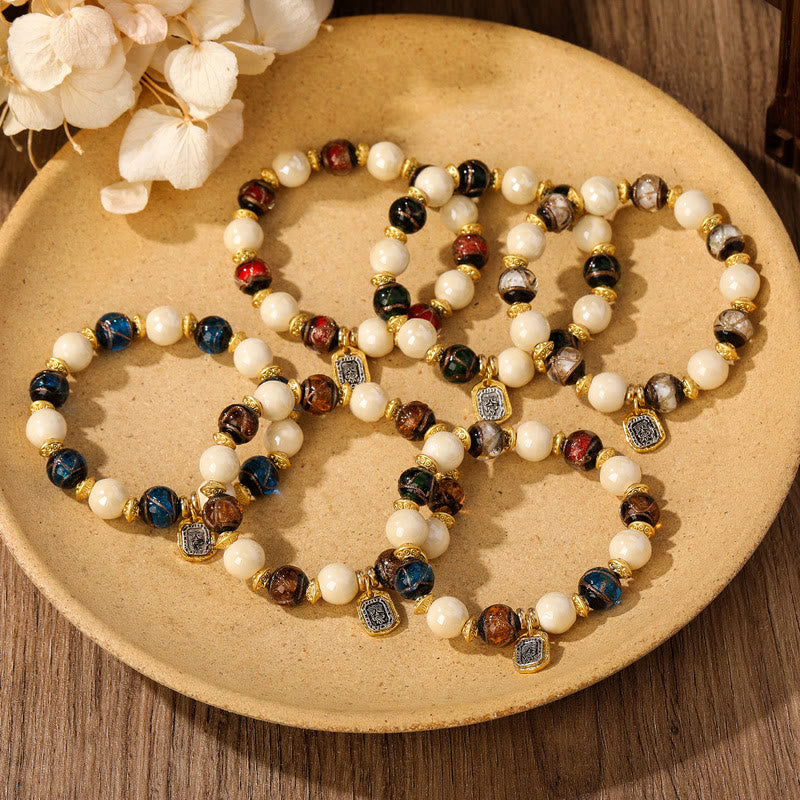 Buddha Stones, tibetische Zakiram-Göttin des Reichtums, Charm-Charm, Liuli, Glas, Weihrauch, Asche, Porzellanperlen, Schutzarmband