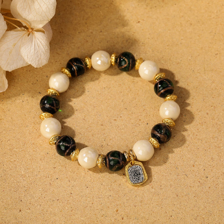 Buddha Stones, tibetische Zakiram-Göttin des Reichtums, Charm-Charm, Liuli, Glas, Weihrauch, Asche, Porzellanperlen, Schutzarmband