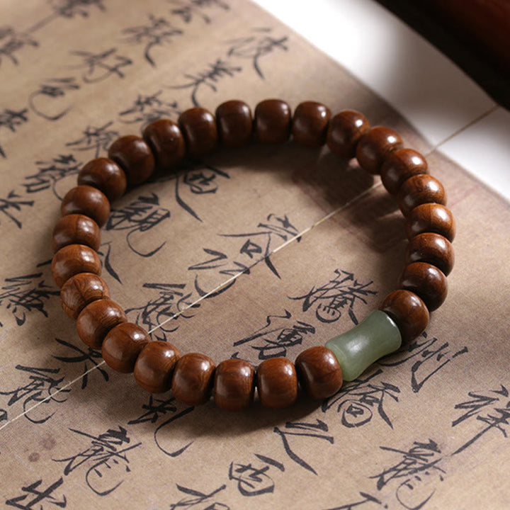 Buddha Stones Armband aus natürlichem Abelia Biflora-Holz, Hetian-Jade und Bambusperle, das böse Geister abwehrt
