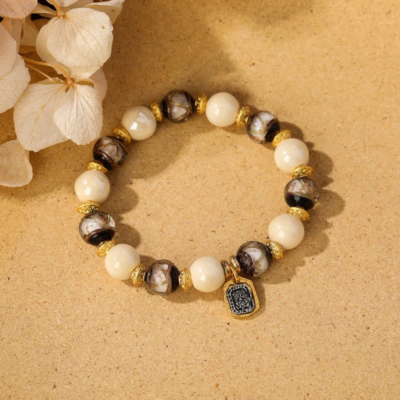 Buddha Stones, tibetische Zakiram-Göttin des Reichtums, Charm-Charm, Liuli, Glas, Weihrauch, Asche, Porzellanperlen, Schutzarmband