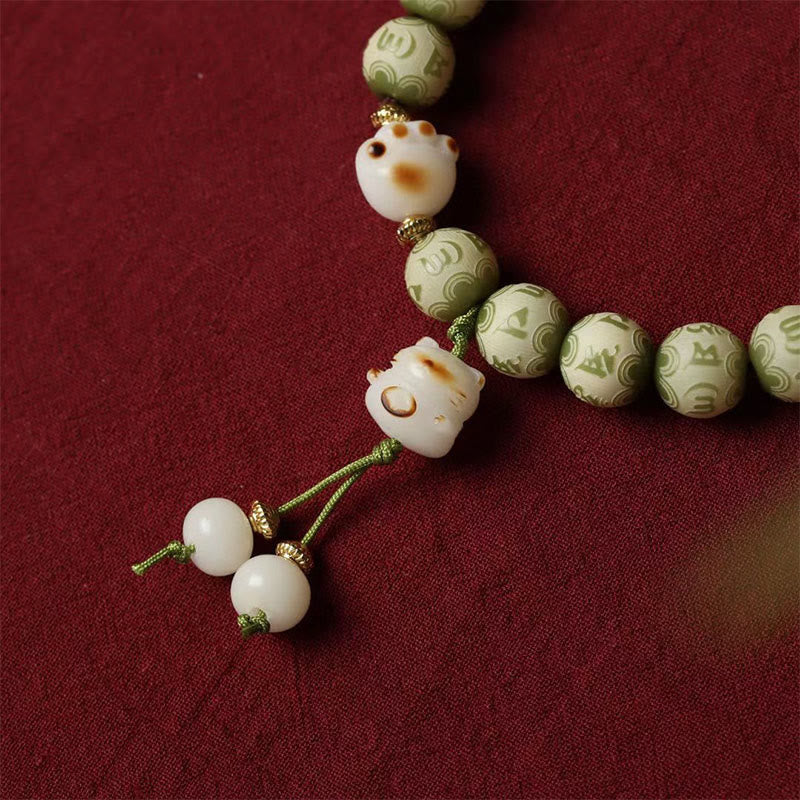 Buddha Stones, grüner Bodhi-Samen, Katzenpfote, Om Mani Padme Hum, graviertes Weisheitsarmband - image 5