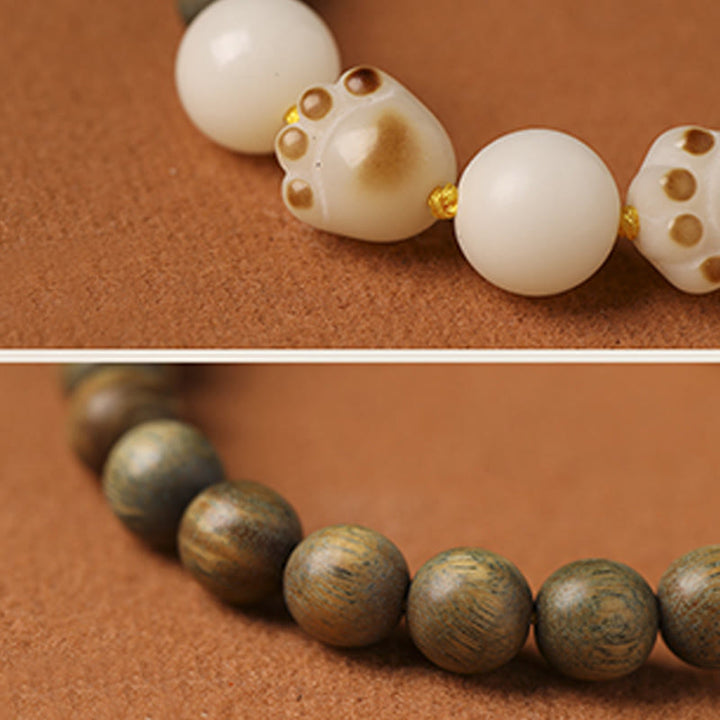 Buddha Stones natürliches grünes Sandelholz-Bodhi-Samen-Katzenpfoten-Klauen-Heilungsarmband - image 8