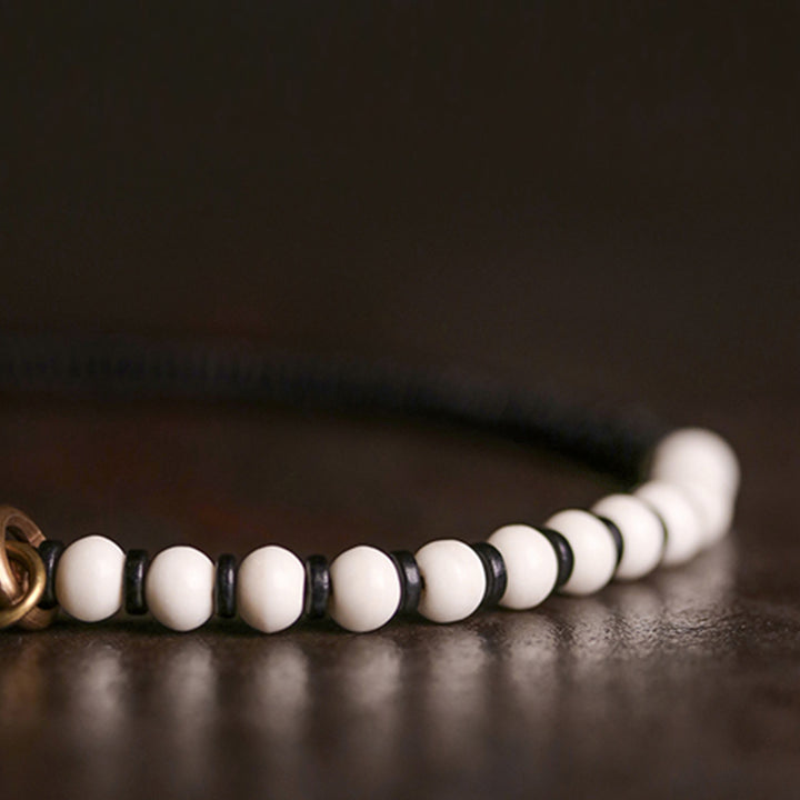 Buddha Stones Knochenperlen Ebenholz Kupfer Stärke Paar Armband