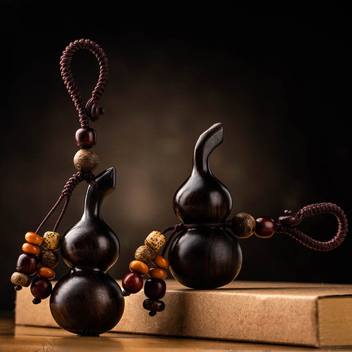 Schlüsselanhänger aus tibetischem Ebenholz, kleinem Blatt, rotem Sandelholz, Kürbis, Glücksschutz