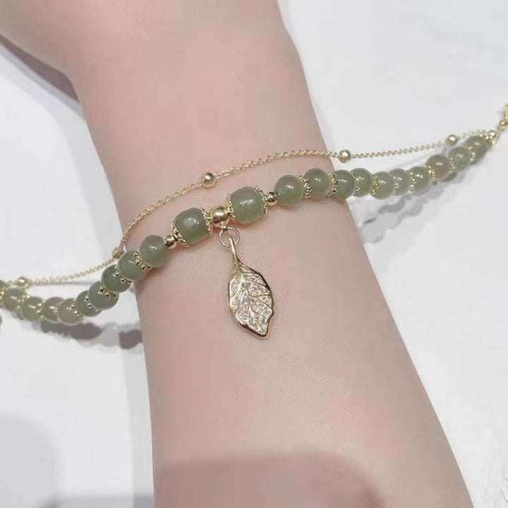 Perlenarmband mit Buddha Stonesn, Jadeblatt, Ginkgo-Tulpe, Erdnuss-Fu-Charakter, Glücksperlen