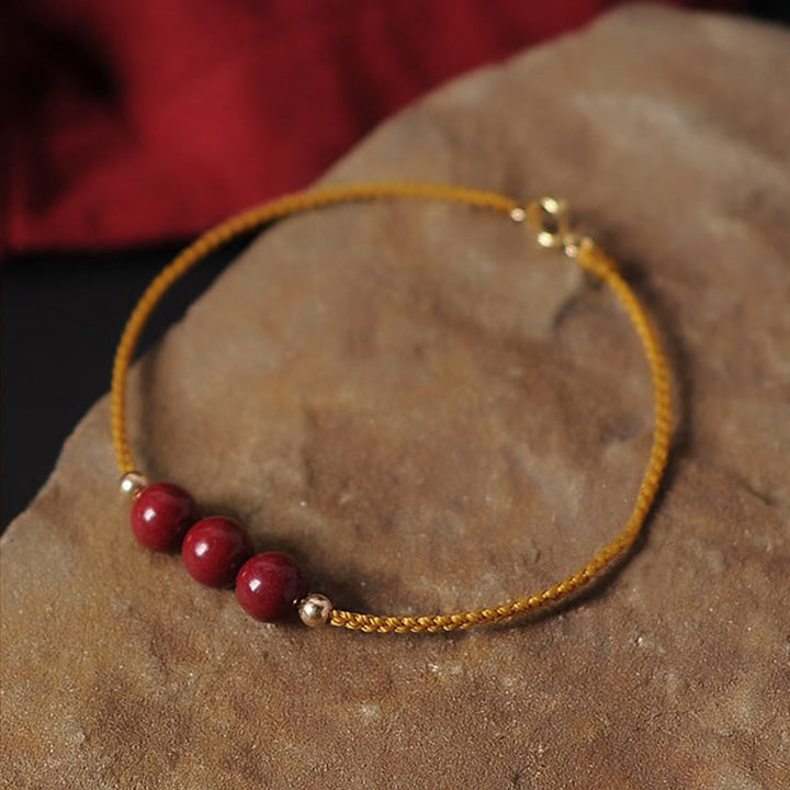 Buddha Stones 14K vergoldetes natürliches Zinnober-Segensband-Geflochtenes Armband