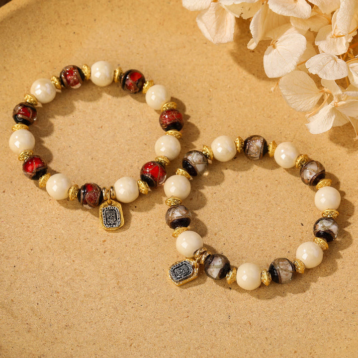 Buddha Stones, tibetische Zakiram-Göttin des Reichtums, Charm-Charm, Liuli, Glas, Weihrauch, Asche, Porzellanperlen, Schutzarmband