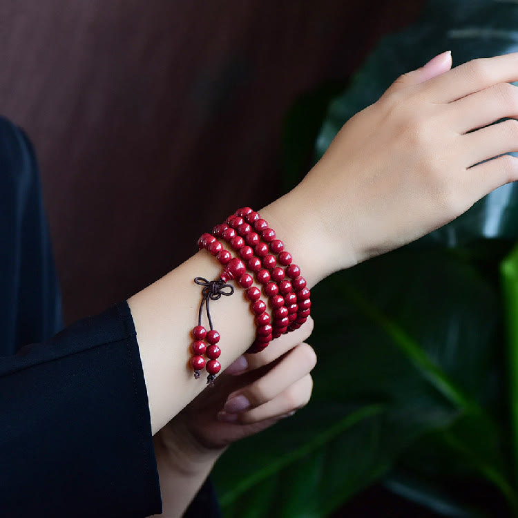 Buddha Stones 108 Mala Perlen Zinnober Om Mani Padme Hum Muster graviertes Segensarmband