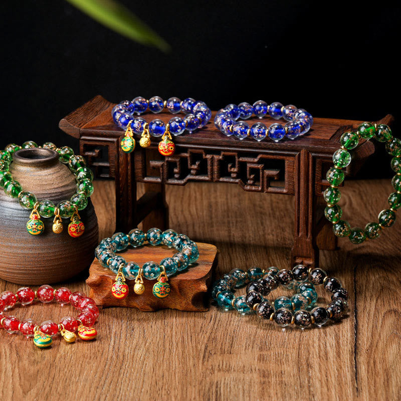 Buddha Stones Gold Schlucktier Familie Charm Leuchtendes fluoreszierendes Liuli-Glasperlen-Erfolgsarmband