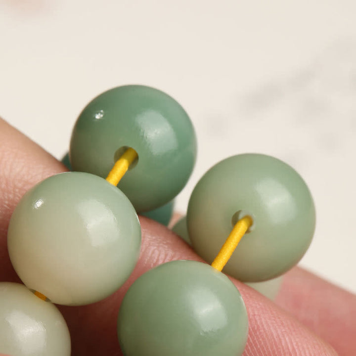 Natürlicher Farbverlauf Bodhi Seed Fortune Geldbeutel Lotus Weisheit Quaste Handgelenk Mala