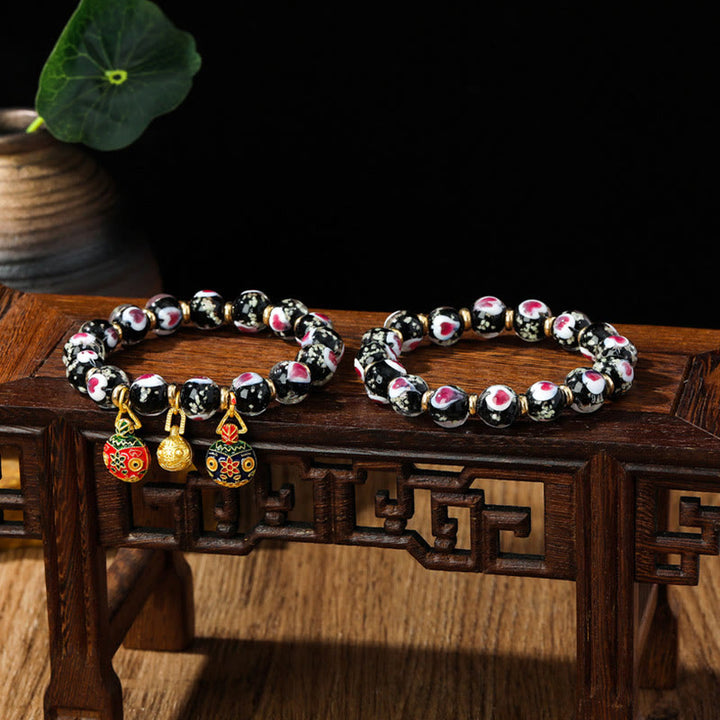 Buddha Stones Gold Schluckendes Biest Familie Rosa Liebesherz Leuchtendes fluoreszierendes Liuli-Glasperlenarmband