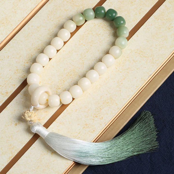 Natürlicher Farbverlauf Bodhi Seed Fortune Geldbeutel Lotus Weisheit Quaste Handgelenk Mala