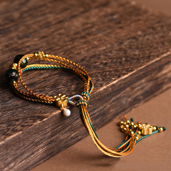 Buddha Stones Tibetisches handgemachtes Seil Liuli Glasperlen geflochtenes mehrschichtiges Heilarmband