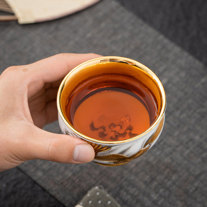 Buddha Stones, goldener Adler, verheißungsvoller Drache, Sonne, Ozean, Wellen, vergoldete Keramik-Teetasse, Kung-Fu-Teetasse