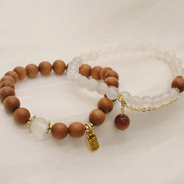 Buddha Stones Sandelholz Katzenauge Fu Charakter Charm Schutzarmband