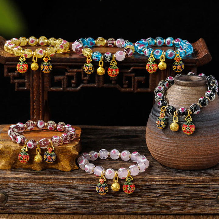 Buddha Stones Gold Schluckendes Biest Familie Rosa Liebesherz Leuchtendes fluoreszierendes Liuli-Glasperlenarmband