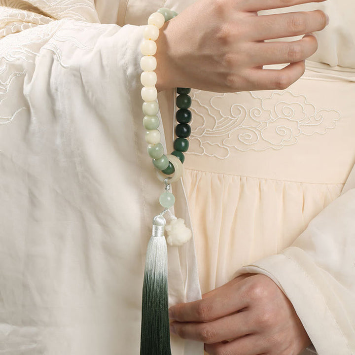 Natürlicher Farbverlauf Bodhi Seed Fortune Geldbeutel Lotus Weisheit Quaste Handgelenk Mala