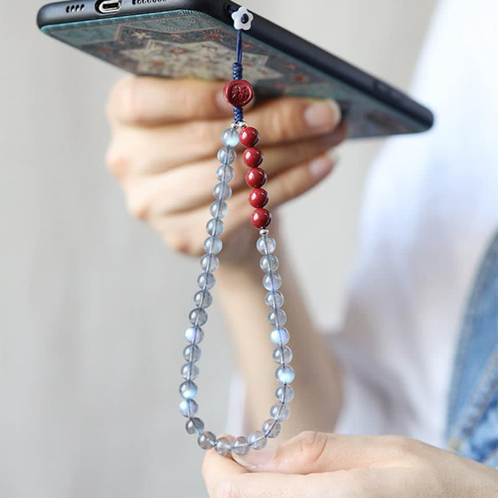 Natürlicher Mondstein, Zinnober, ruhige, positive Telefondekoration