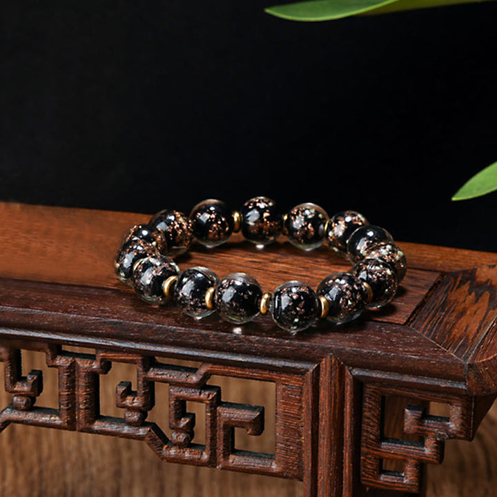 Buddha Stones Gold Schlucktier Familie Charm Leuchtendes fluoreszierendes Liuli-Glasperlen-Erfolgsarmband