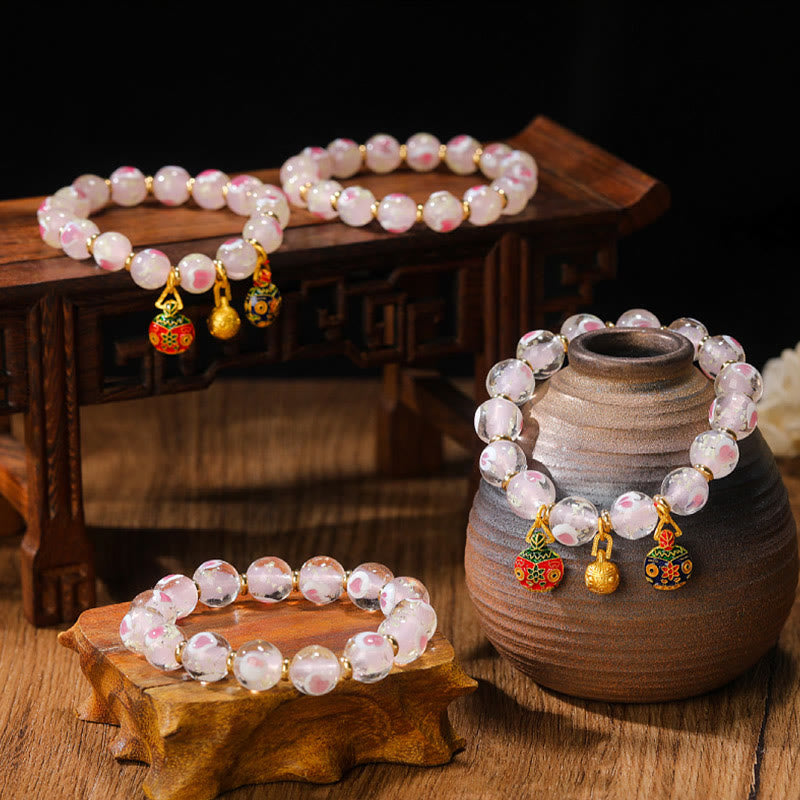 Buddha Stones Gold Schluckendes Biest Familien-Charm, leuchtendes rosa Liebesherz, fluoreszierendes Liuli-Glasperlen-Segens-Armband