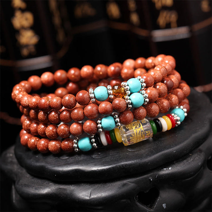 Buddha Stones 108 Mala Perlen Goldstone Om Mani Padme Hum Swastika Confidence Armband