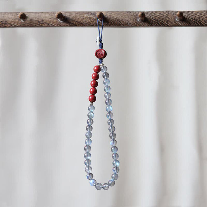 Natürlicher Mondstein, Zinnober, ruhige, positive Telefondekoration